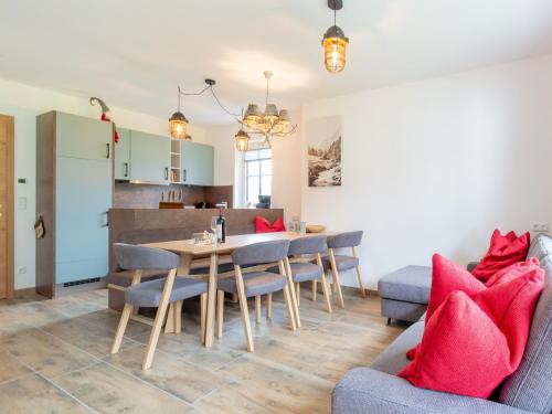 a kitchen and dining room with a table and chairs at Chalet in Krimml near Ski Slopes in Krimml