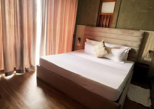 Ένα ή περισσότερα κρεβάτια σε δωμάτιο στο Diyakawa Boutique Hotel