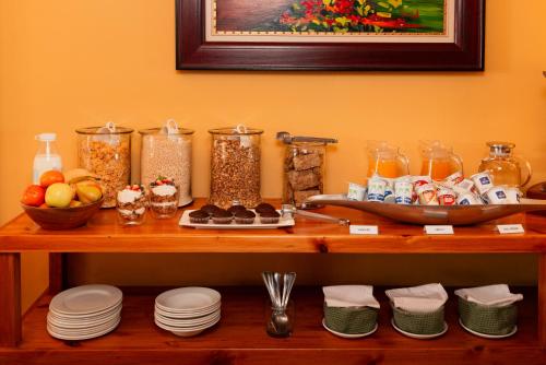 a table with food and other items on it at 88 Baron van Reede Guesthouse in Oudtshoorn