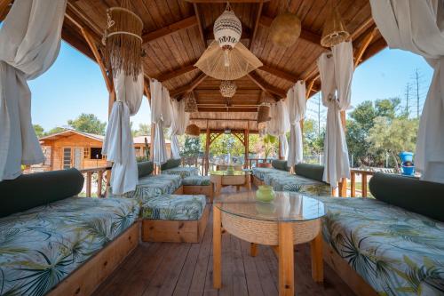 a living room with couches and a table at Lakala Complexe Touristique in O Ben Slimane