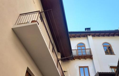 a view of a building with a balcony at Antica Dimora in Levico Terme