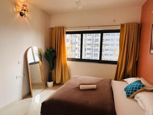 Postel nebo postele na pokoji v ubytování Mocha Private 1 5 BHK Apt Amanora Park Town