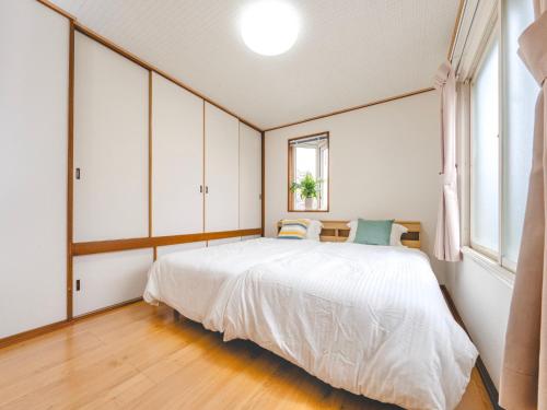 Postel nebo postele na pokoji v ubytování Shishimai Kushiro