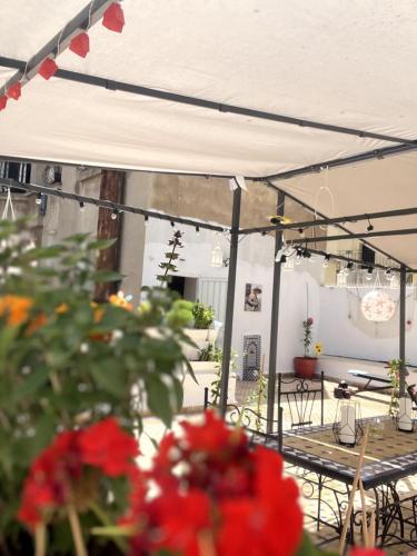 a group of tables and chairs under a white tent at Dar EL BAHIA - Spacious flat with large Terrace in Casablanca