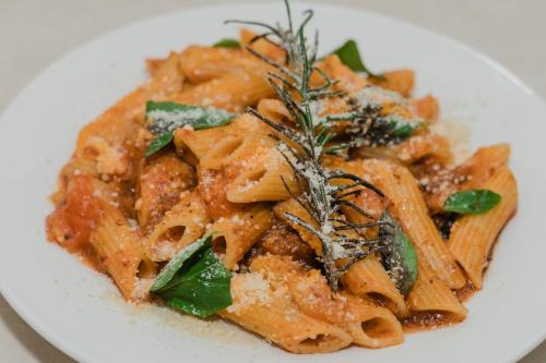 a plate of pasta on a white plate at The New View by Ecotel - Cebu in Cebu City
