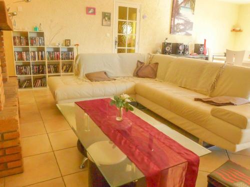 a living room with a couch and a coffee table at Peaceful Escape in Argeliers in Argeliers