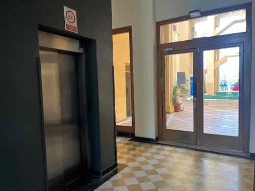 an entrance to a building with a revolving door at Apartamento lux capilla in Seville