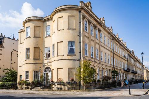 a large building on the side of a street at Dukes Bath in Bath