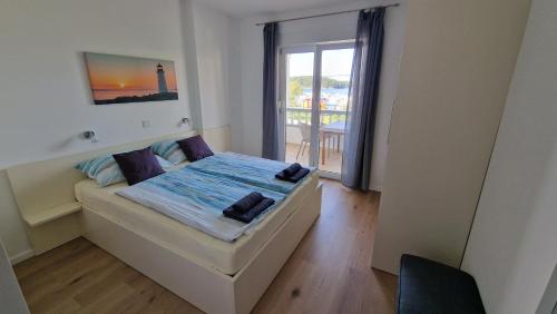 Katil atau katil-katil dalam bilik di Apartmani Devcic
