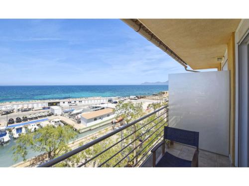 a balcony with a view of the ocean at Harborfront Escape in Mallorca in Can Picafort
