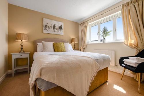 a bedroom with a large bed and a window at WhiskAwayStays Toulouse Drive in Norton Junction