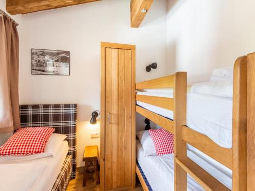a bunk bed room with two bunk beds in a room at Chalet in Niedernsill near Ski Slopes in Niedernsill