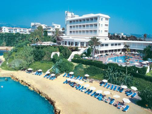an aerial view of a resort with a pool and beach at Cynthiana Beach Hotel in Paphos