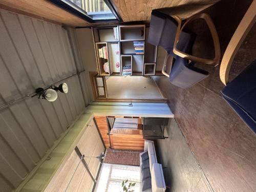an overhead view of a room with a table and chairs at Caliu Earthship Ecolodge in Colonia del Sacramento