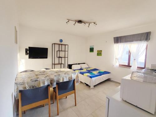 Televisyen dan/atau pusat hiburan di Olcsica Apartment