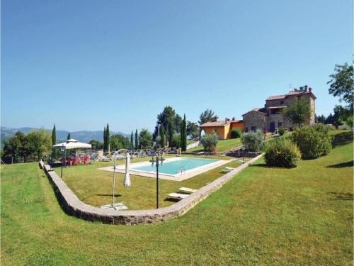 a swimming pool in the middle of a park at Villa in Montalbano with Scenic Views in Città di Castello