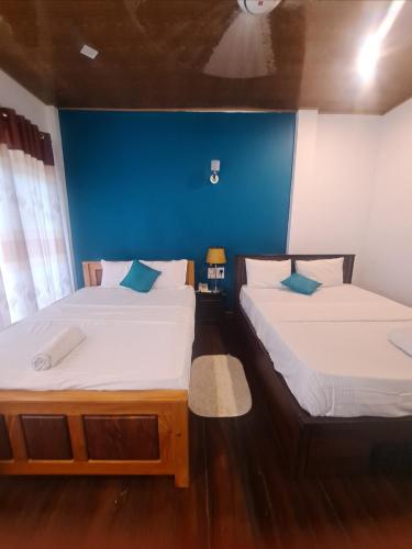 Ένα ή περισσότερα κρεβάτια σε δωμάτιο στο Lavendra Hotel