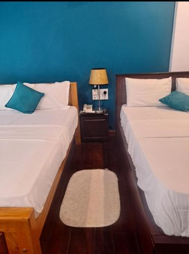 Ένα ή περισσότερα κρεβάτια σε δωμάτιο στο Lavendra Hotel