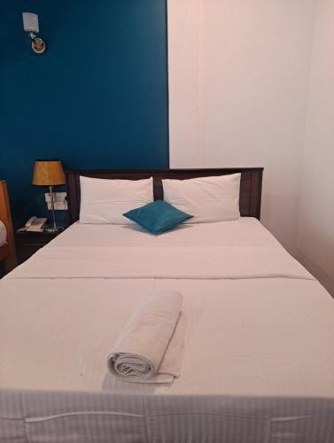 Ένα ή περισσότερα κρεβάτια σε δωμάτιο στο Lavendra Hotel