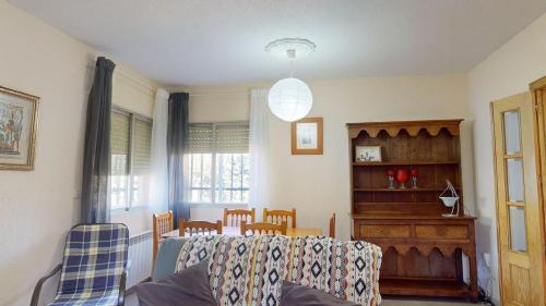 a living room with a couch and a table at Chalet BS in Albalate de Zorita