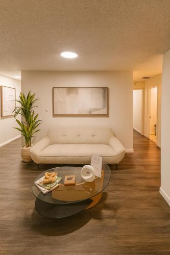 a living room with a couch and a table at Santamaria Fort Lauderdale Airport in Fort Lauderdale