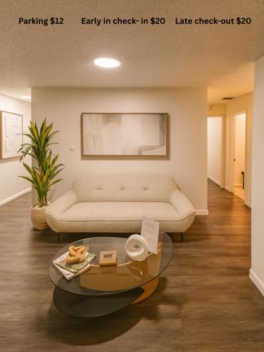 a living room with a couch and a table at Santamaria Fort Lauderdale Airport in Fort Lauderdale