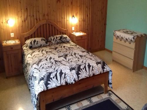 a bedroom with a bed and two night stands at Peaceful Escape, Malmedy in Malmedy