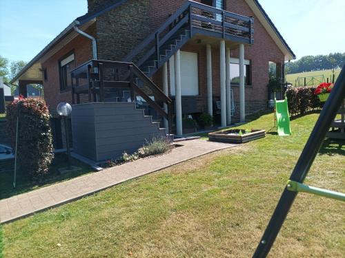 a house with a spiral staircase in the yard at Peaceful Escape, Malmedy in Malmedy