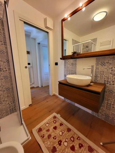 a bathroom with a sink and a mirror at Molo 2 Pila in Gressan