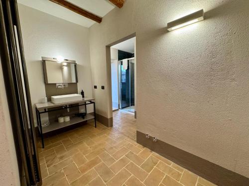 a bathroom with a sink and a mirror at The Monteleone Umbria Retreat in Monteleone dʼOrvieto