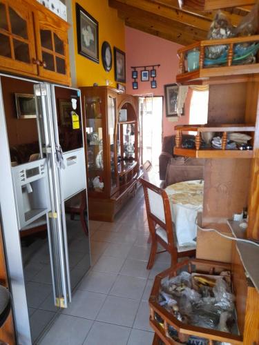 a kitchen with a refrigerator and a dining room at Montego Bay house Centrally located in Montego Bay