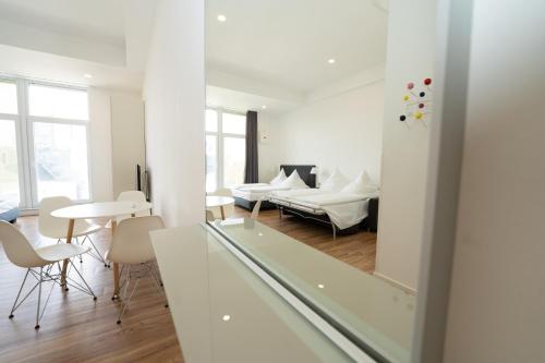 a living room with a couch and a table at Das Loft Apartments in Aachen
