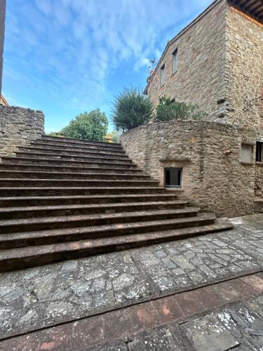 a set of stairs outside of a building at Fairytale apartment in 12th century castle - Umbria in Monte lʼAgello