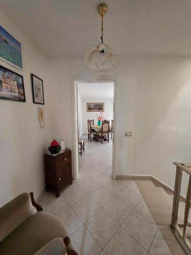 a living room with a couch and a table at Casa vacanza Nicla in Rosolini