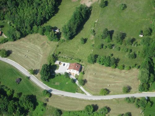an aerial view of a house and a road at Apartment Zadraga in Tolmin
