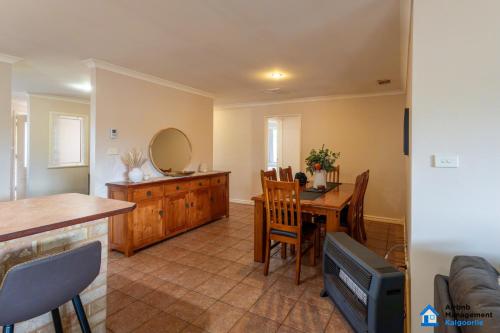 a living room with a table and a dining room at The 4x2 for you and the crew in Williamstown