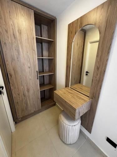 a dressing room with a vanity and a mirror at Cabin in zahra elalamein in El Alamein