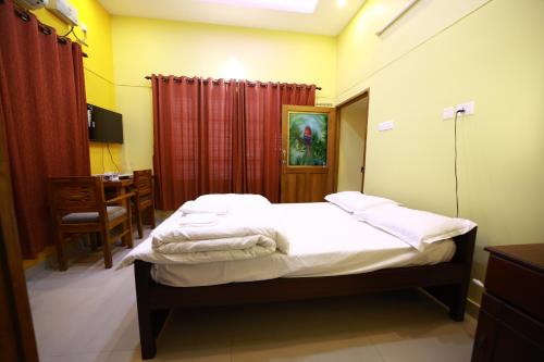 Ένα ή περισσότερα κρεβάτια σε δωμάτιο στο Spice Haven Homestay