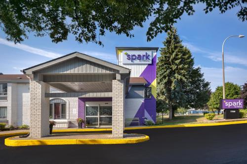 a rendering of a spartaky store on a street at Spark by Hilton Brockville in Brockville