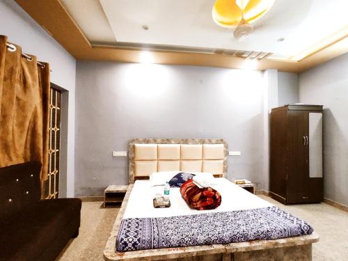 a bedroom with a bed in a room at CRYSTAL HOMESTAY & PG - Secure, Budget and Comfortable Stay in Phagwāra
