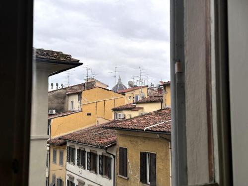 a view from a window of roofs of buildings at Indipendenza 1 in Florence