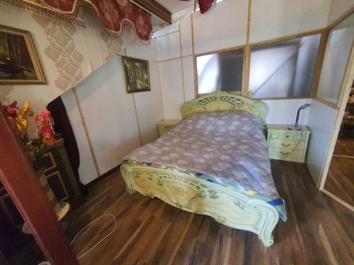a bedroom with a bed in a room at Baltā māja in Rīga