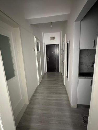 a hallway leading to a door in a building at Mareli in Mostar