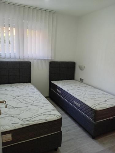 Postel nebo postele na pokoji v ubytování Apartman Volijak 44