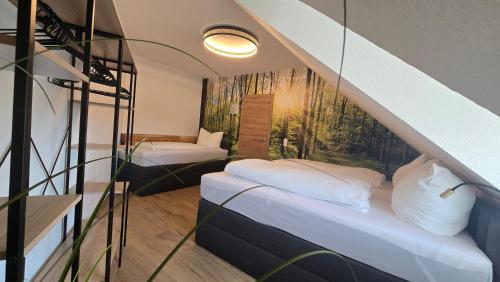a room with two bunk beds and a staircase at Luxus Ferienwohnung Himmel und SPA mit privater Sauna und Wellnessdusche inkl Wifi und Parkplatz für 4Personen in Muhr amSee