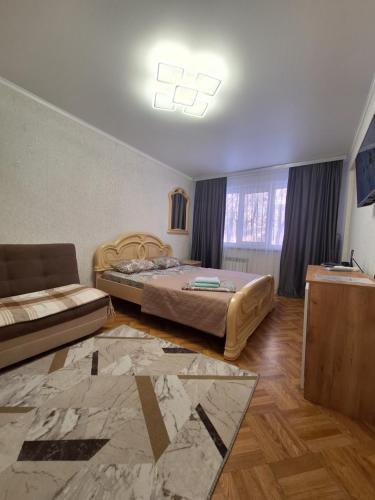 Postel nebo postele na pokoji v ubytování Квартира