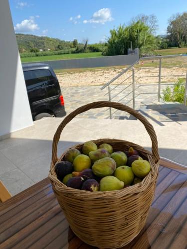 a basket of fruit sitting on top of a table at Vians Olympia Resort in Olympia