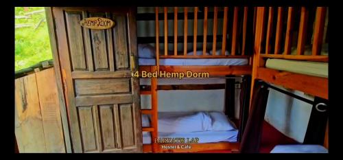 an open door to a room with two bunk beds at Parvatis Lap Luxury Hostel & Camps in Kasol