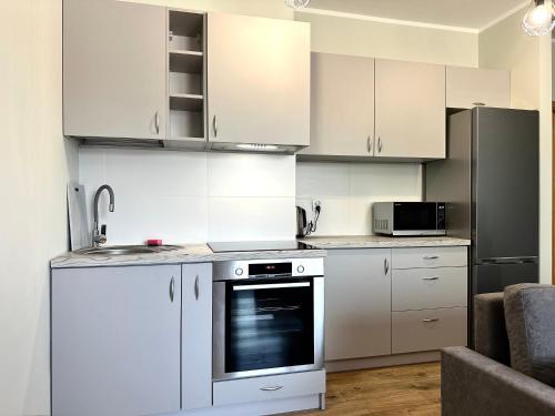 Η κουζίνα ή μικρή κουζίνα στο Marcinowska 2 Apartment - Self check-in 20h - parking