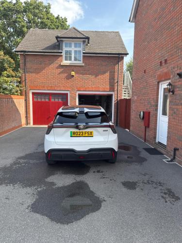 a white car parked in front of a house at Guest Room by Amanda & David in Devizes Wiltshire in Bishops Cannings